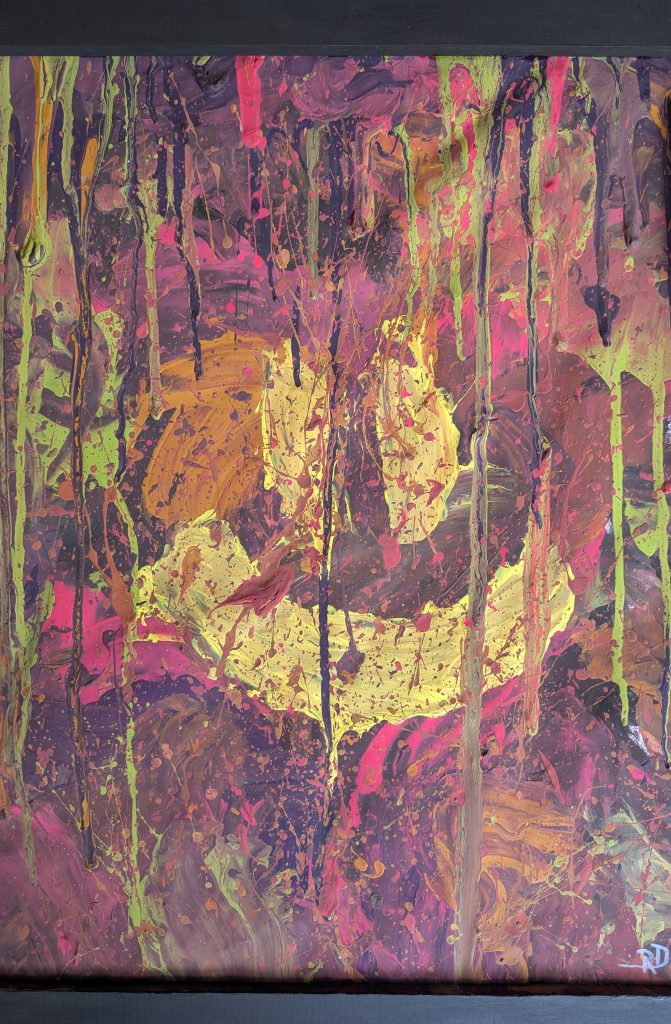 Ein abstraktes Bild mit vielen Farben und einem gelben smiley.